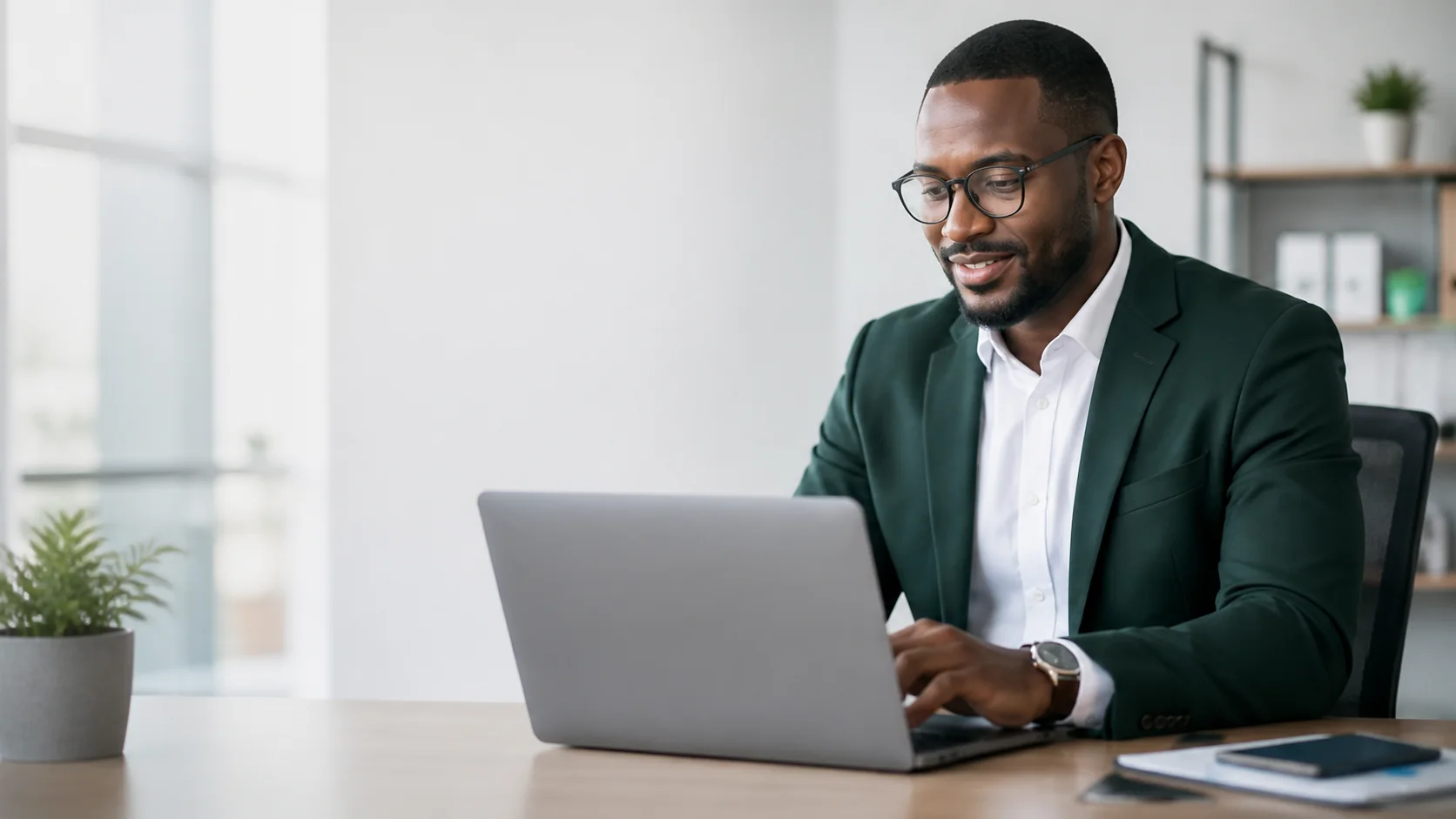 Finance adviser reviewing business information on a laptop
