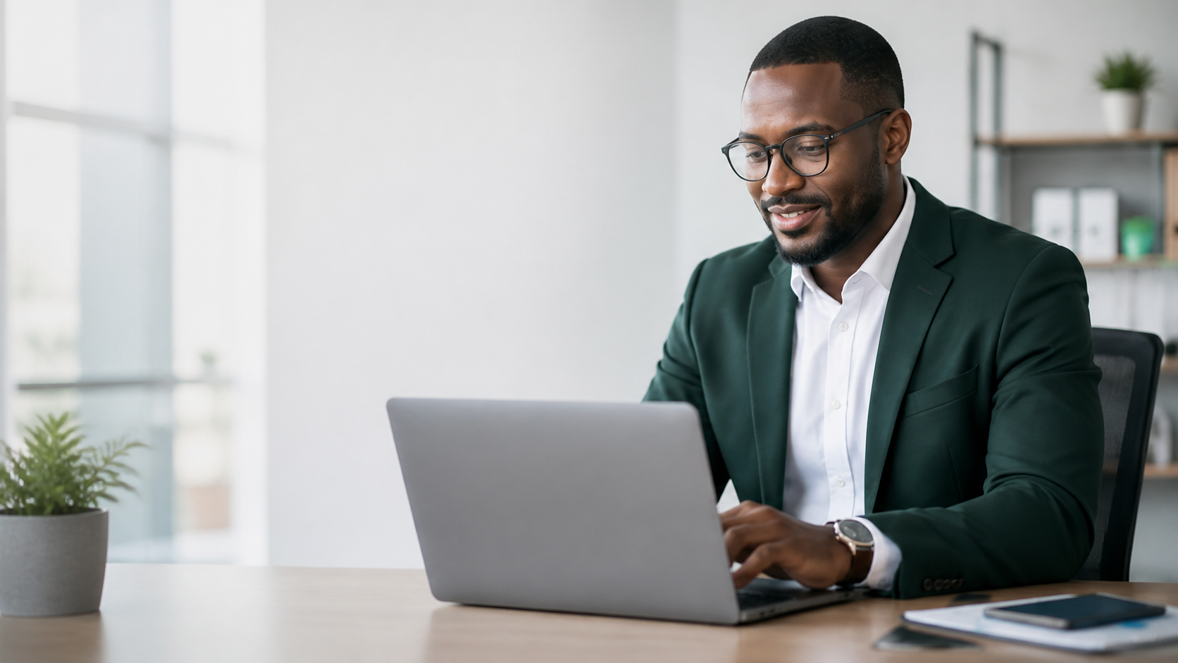 Finance adviser reviewing business information on a laptop